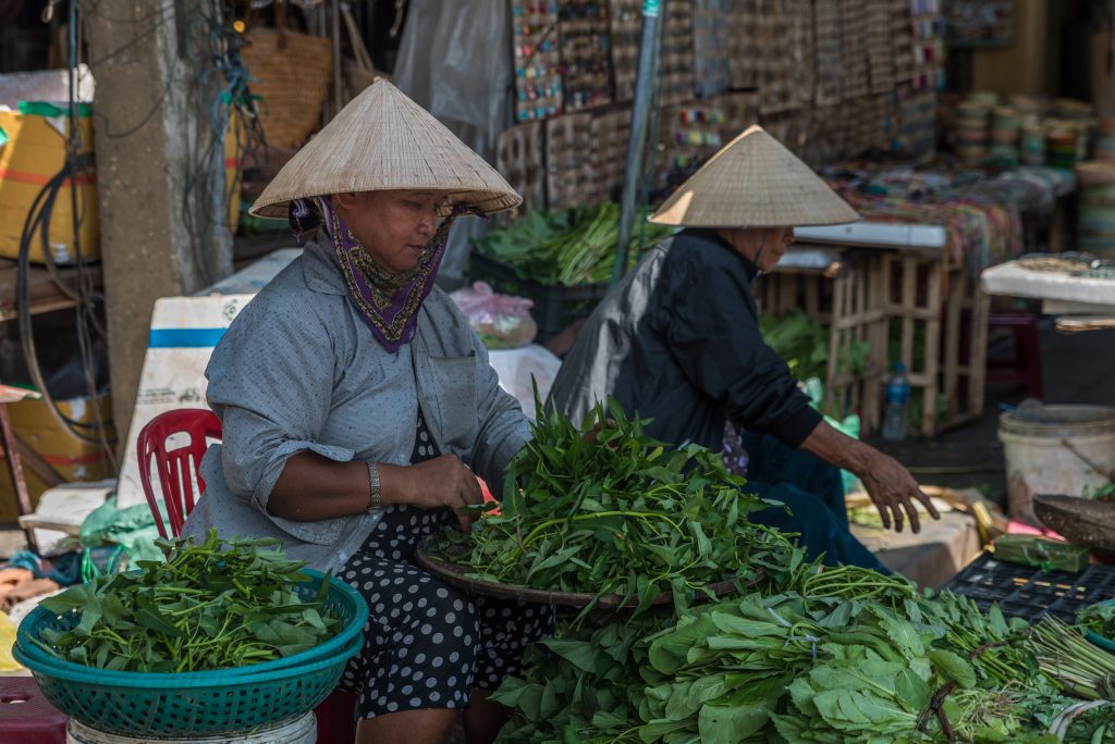 women selling vegetables in hoi an market